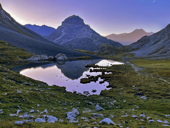 Scenic view of lake and mountains against sky