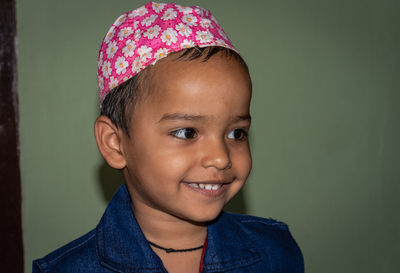 Close-up of smiling boy wearing cap