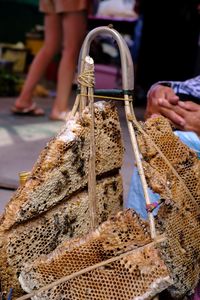 People holding ice cream for sale in market