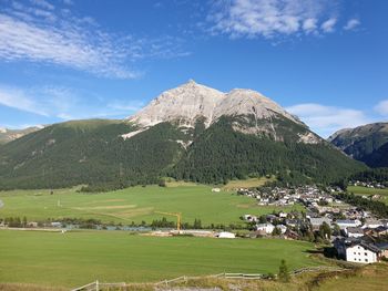 Scenic view of landscape and mountains against sky