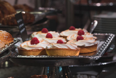 Close-up of desserts in tray on table