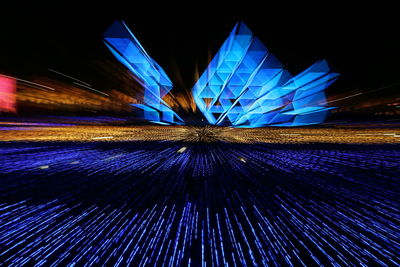 Low angle view of illuminated building at night