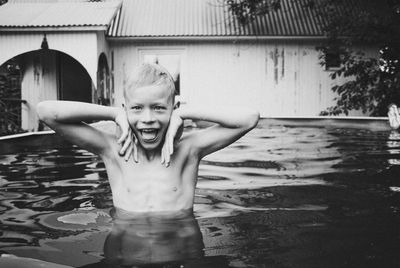 Portrait of young woman in water