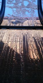 Close-up of window against sky during winter