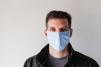 Man wearing homemade cloth face mask during covid 19 pandemic.