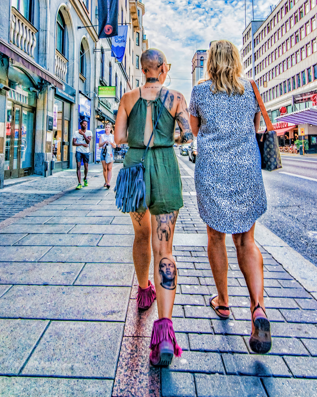 city, women, full length, architecture, street, togetherness, adult, walking, building exterior, group of people, city life, females, day, mid adult, leisure activity, men, real people, males, fashion, outdoors, city street, positive emotion