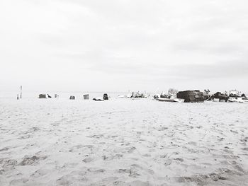 Group of objects in distance at beach