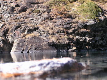 Reflection of rocks in sea