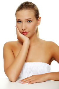 Portrait of a beautiful young woman over white background