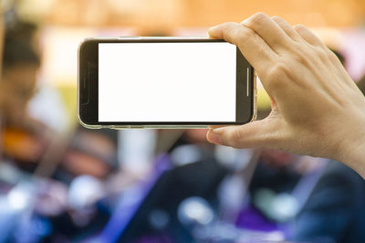 Close-up of hand holding smart phone