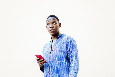 Young black man with his smartphone in hand