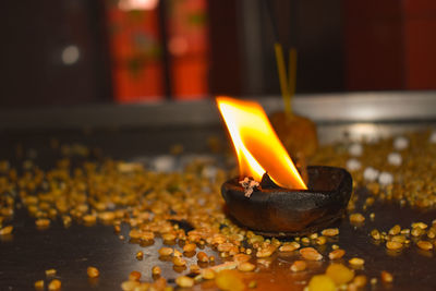 Close-up of diya in temple