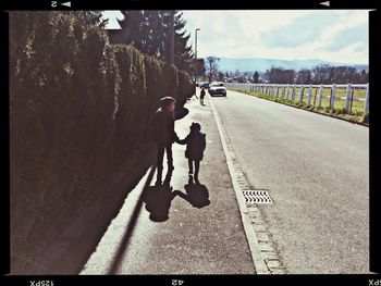 Woman walking on road