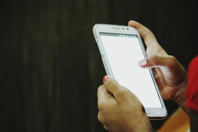 Close-up of woman using mobile phone