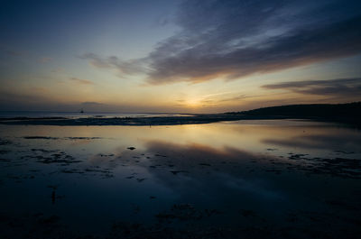 Scenic view of sea against sky at sunset