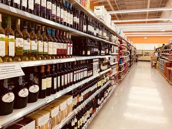 Stack of bottles on display at store