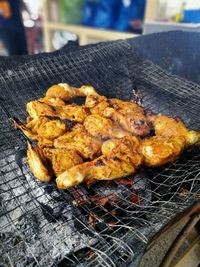 Close-up of meat on barbecue grill