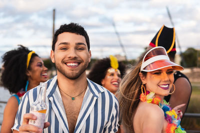 Portrait of smiling man with friends