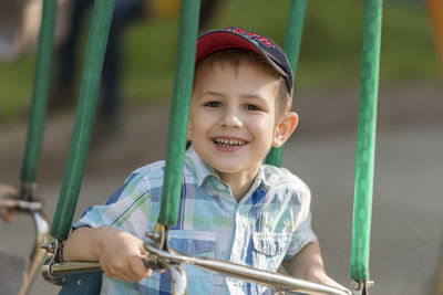 Portrait of smiling boy in playground