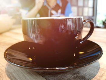 Close-up of coffee cup on table
