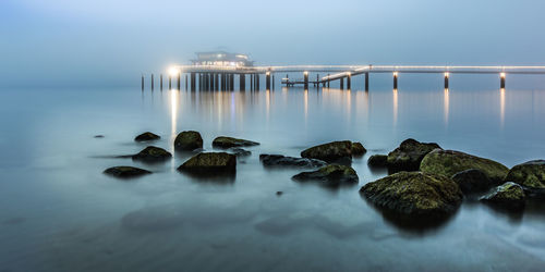 Scenic view of sea against sky at dusk