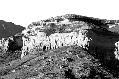 Panoramic shot of rocks against clear sky