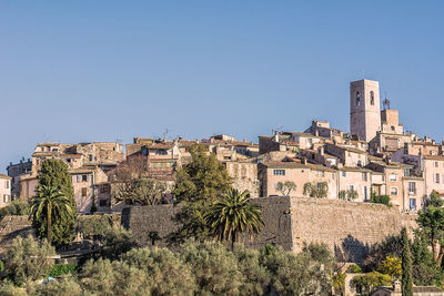 View of cityscape against blue sky