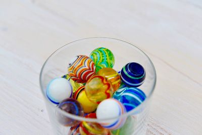 High angle view of candies in glass on table