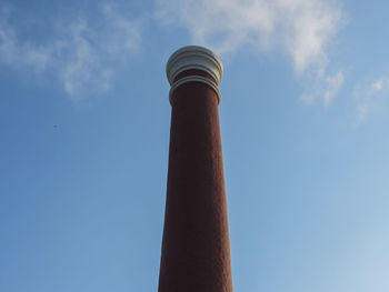 Low angle view of smoke stack against sky