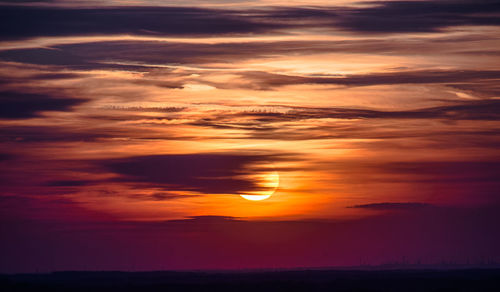 Scenic view of dramatic sky during sunset