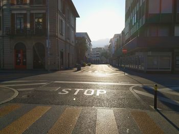 Surface level of road amidst buildings in city