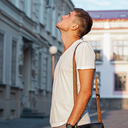 Side view of young man looking away