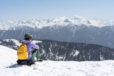 Man skiing on snowcapped mountain