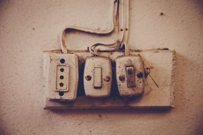 Close-up of telephone on wall