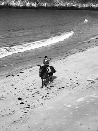 Full length of men on beach