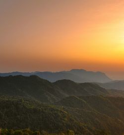 Scenic view of mountains against sky during sunset