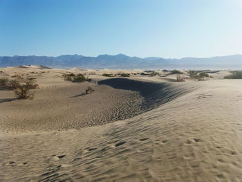 Scenic view of desert against clear sky