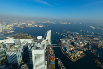 High angle view of modern buildings in yokohama city against sky