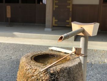 Close-up of cross on street