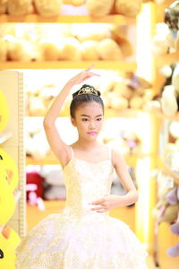 Girl in dress dancing at home