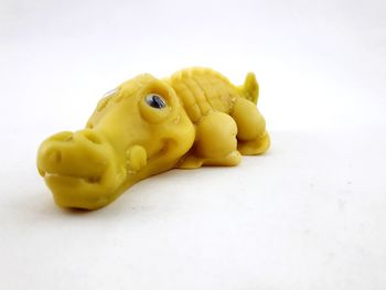 Close-up of a stuffed toy over white background