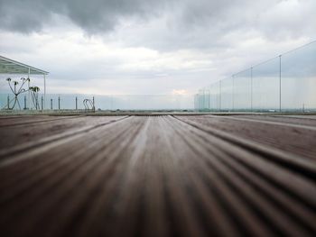Surface level of railroad tracks against sky