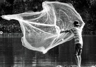 Man fishing in lake