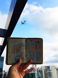 Man holding open passport