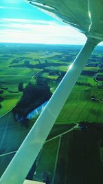 Aerial view of landscape seen through airplane window