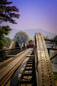 Train on railroad tracks against sky