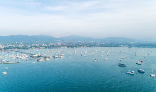 High angle view of sailboats in sea against sky