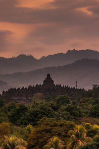 Scenic view of mountain against cloudy sky