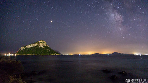 Scenic view of sea against sky at night