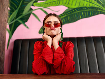 Young woman sitting on table